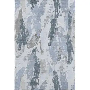 Photo of Sky Blue Gray And Ivory Abstract Washable Area Rug With UV Protection