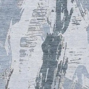 Photo of Sky Blue Gray And Ivory Abstract Washable Area Rug With UV Protection