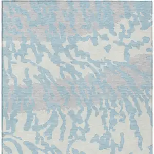 Photo of Sky Blue Gray And Ivory Animal Print Washable Indoor Outdoor Area Rug
