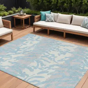 Photo of Sky Blue Gray And Ivory Animal Print Washable Indoor Outdoor Area Rug