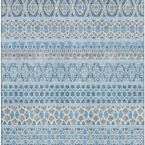 Photo of Sky Blue Gray And Ivory Ikat Washable Area Rug With UV Protection