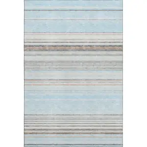 Photo of Sky Blue Gray And Ivory Striped Washable Area Rug With UV Protection