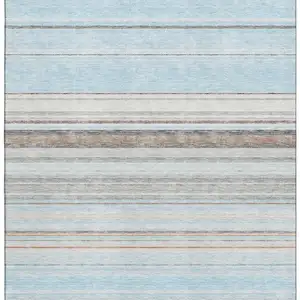 Photo of Sky Blue Gray And Ivory Striped Washable Area Rug With UV Protection