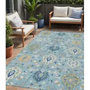 Photo of Sky Blue Ivory And Gold Damask Washable Indoor Outdoor Area Rug