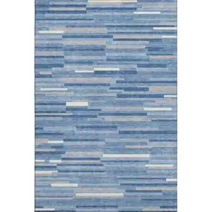 Photo of Sky Blue Ivory And Gray Striped Washable Area Rug With UV Protection