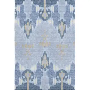 Photo of Sky Blue Ivory And Tan Ikat Washable Area Rug With UV Protection