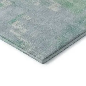 Photo of Sky Blue Ivory And Teal Abstract Washable Area Rug With UV Protection