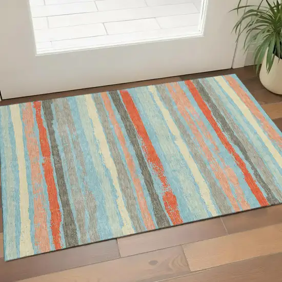 Sky Blue Orange And Ivory Striped Washable Area Rug With UV Protection Photo 1