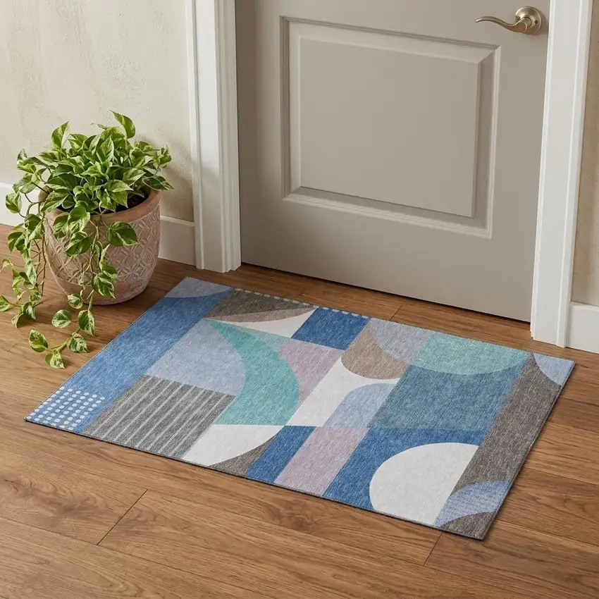 Sky Blue Teal And Ivory Geometric Washable Area Rug With UV Protection Photo 1