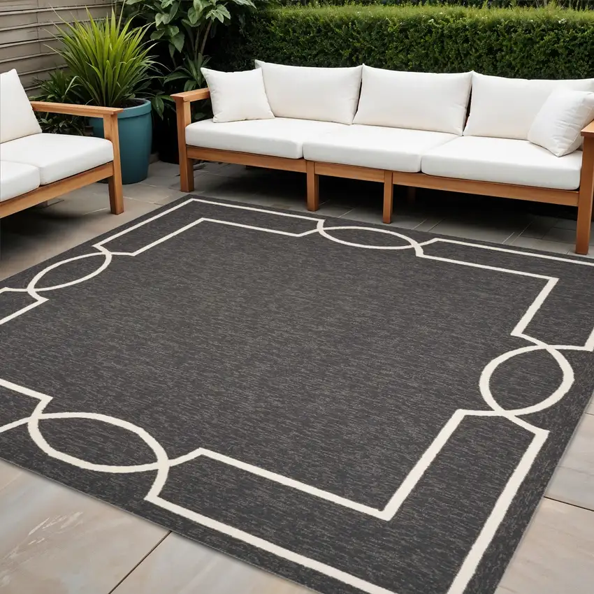 7' Black And White Square Geometric Indoor Outdoor Area Rug Photo 1