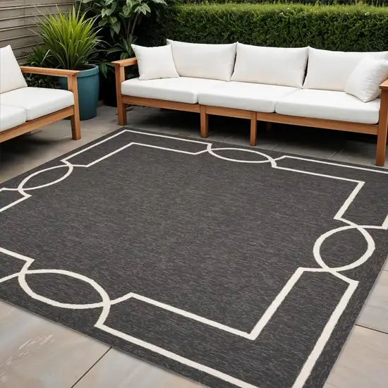 7' Black And White Square Geometric Indoor Outdoor Area Rug Photo 1