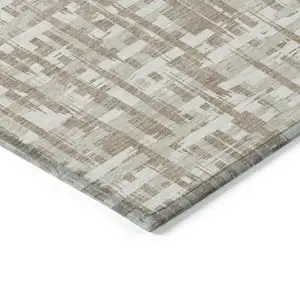 Photo of Tan And Beige Abstract Washable Indoor Outdoor Area Rug