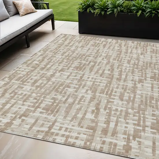 Tan And Beige Abstract Washable Indoor Outdoor Area Rug Photo 1