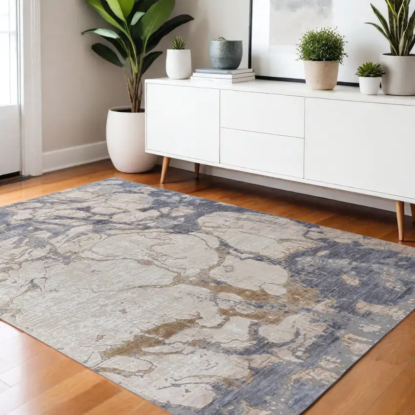 Tan Blue And Beige Abstract Distressed Area Rug Photo 1