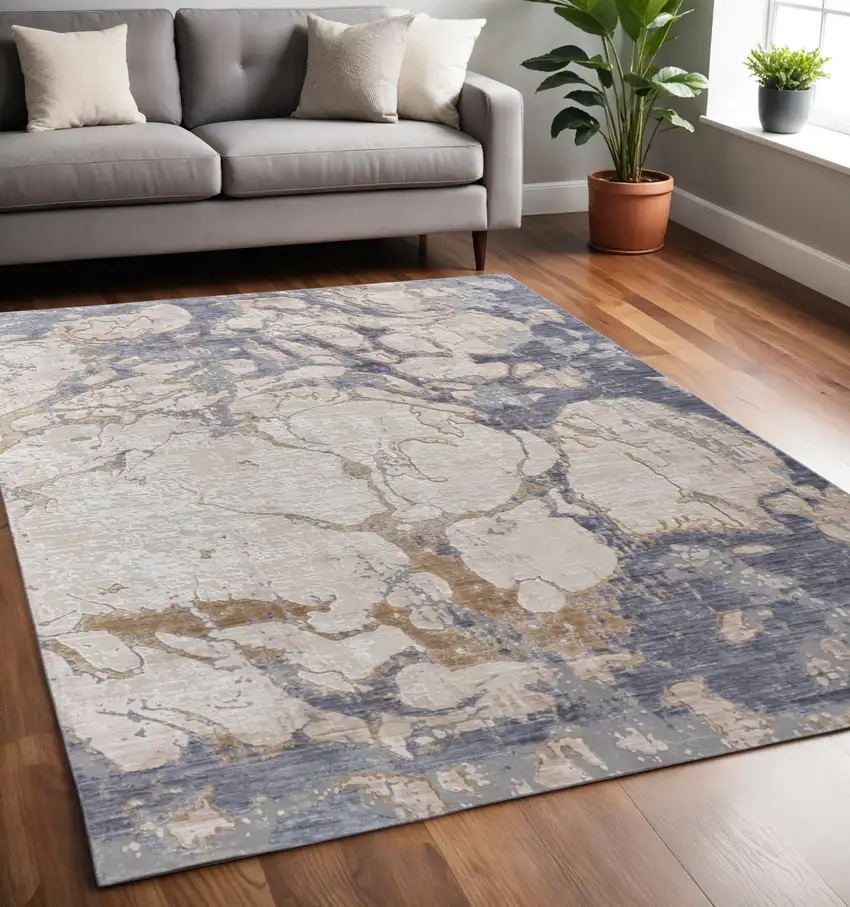 Tan Blue And Beige Abstract Distressed Area Rug Photo 1