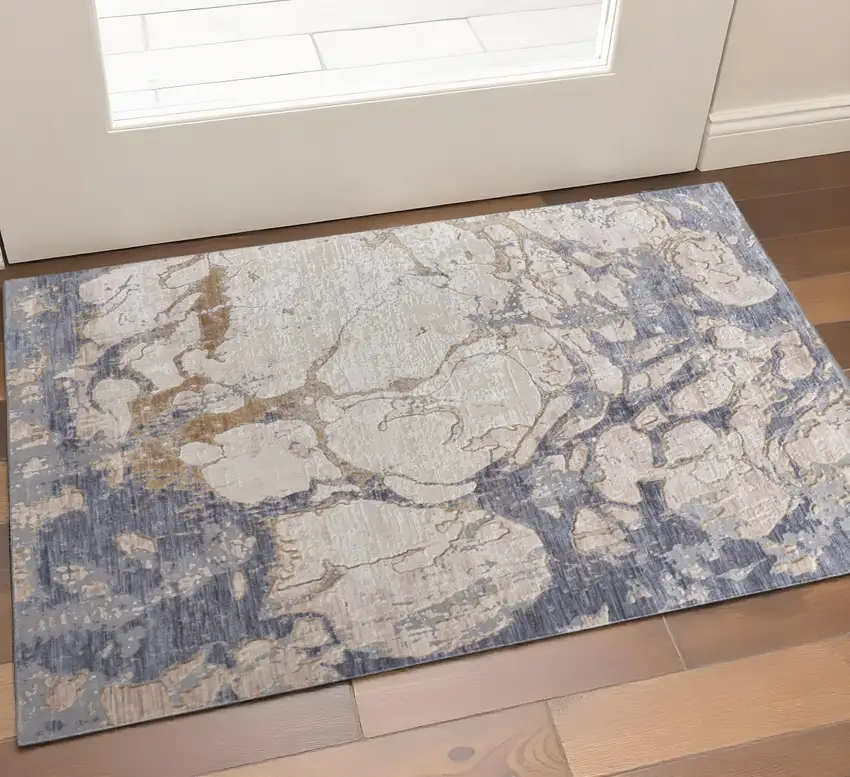 Tan Blue And Beige Abstract Distressed Area Rug Photo 1