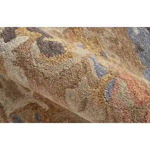 Photo of Tan And Blue Wool Abstract Tufted Handmade Stain Resistant Area Rug