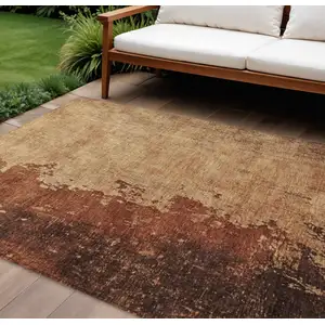 Photo of Tan And Copper Abstract Washable Indoor Outdoor Area Rug