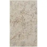 Photo of Tan And Ivory Abstract Power Loom Distressed Area Rug