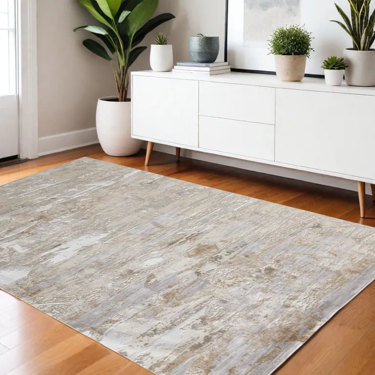 Tan And Ivory Abstract Power Loom Distressed Area Rug Photo 1