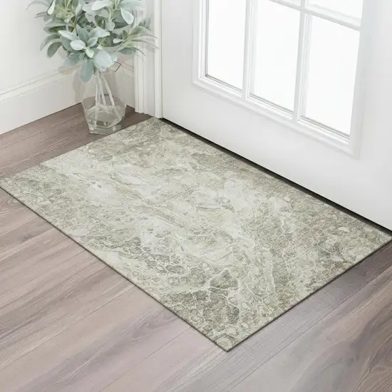 Tan And Ivory Abstract Washable Area Rug With UV Protection Photo 1