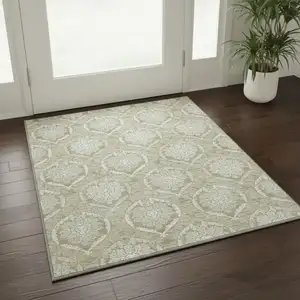 Photo of Tan And Ivory Medallion Washable Area Rug With UV Protection