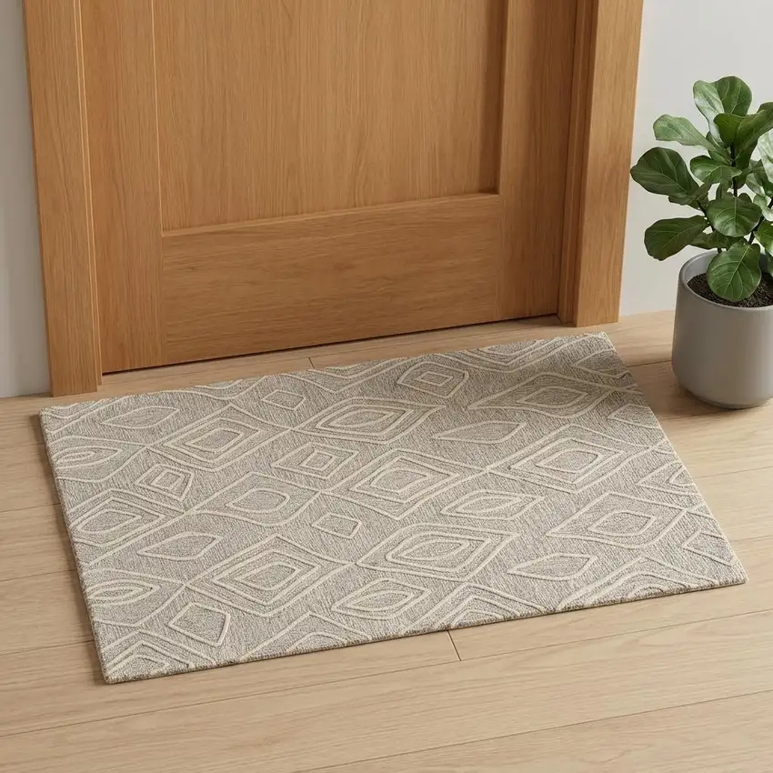 Tan And Ivory Wool Geometric Tufted Handmade Stain Resistant Area Rug Photo 1