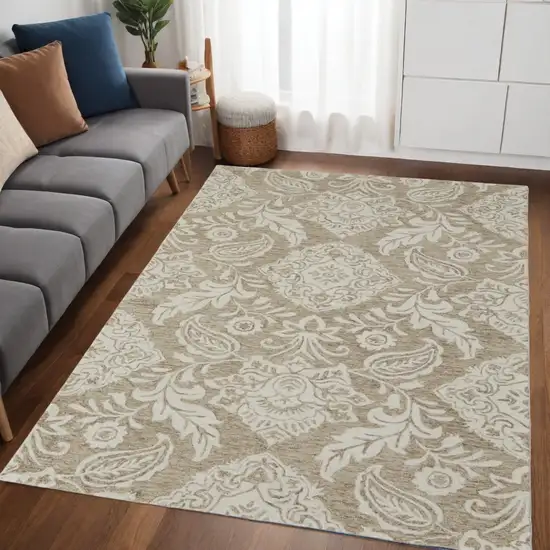 Tan And Ivory Wool Paisley Tufted Handmade Stain Resistant Area Rug Photo 1