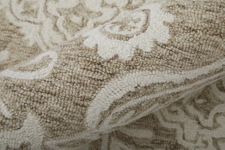 Tan And Ivory Wool Paisley Tufted Handmade Stain Resistant Area Rug Photo 1