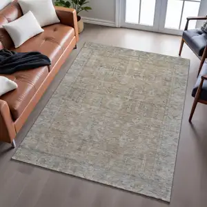 Photo of Tan Beige And Gray Oriental Washable Area Rug With UV Protection
