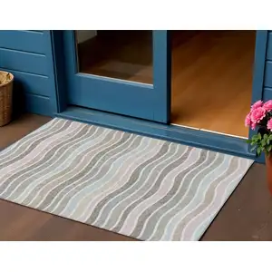 Photo of Tan Beige And Ivory Striped Washable Indoor Outdoor Area Rug