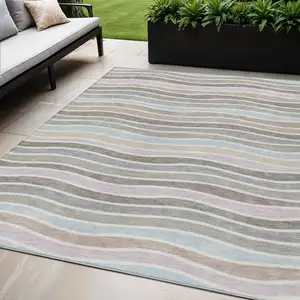 Photo of Tan Beige And Ivory Striped Washable Indoor Outdoor Area Rug
