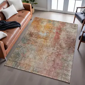 Photo of Tan Beige And Red Abstract Washable Area Rug With UV Protection