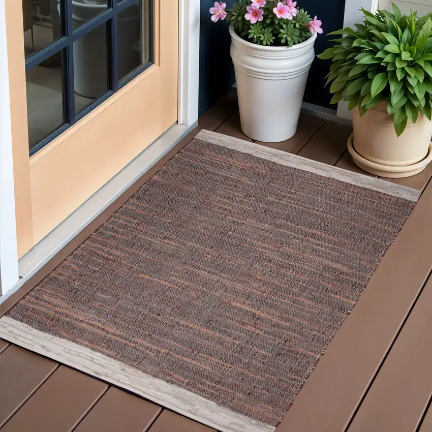 Tan Black and Beige Patchwork Handmade Indoor Outdoor Area Rug Photo 1