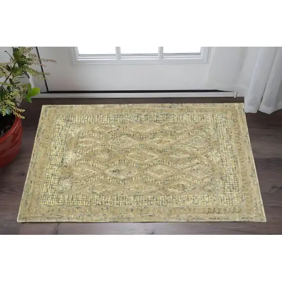 Tan Blue And Gray Wool Floral Tufted Handmade Stain Resistant Area Rug Photo 1