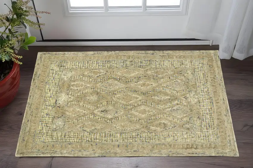 Tan Blue And Gray Wool Floral Tufted Handmade Stain Resistant Area Rug Photo 1