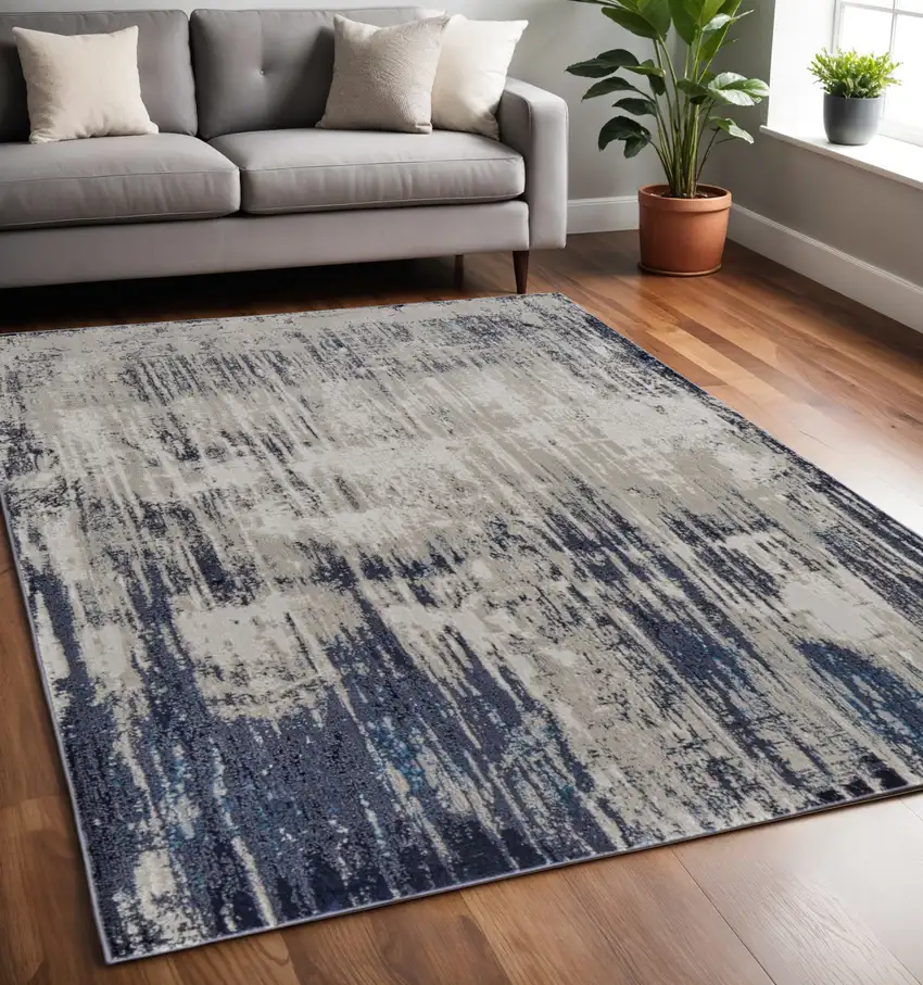 Tan Blue And Ivory Abstract Power Loom Distressed Area Rug Photo 1