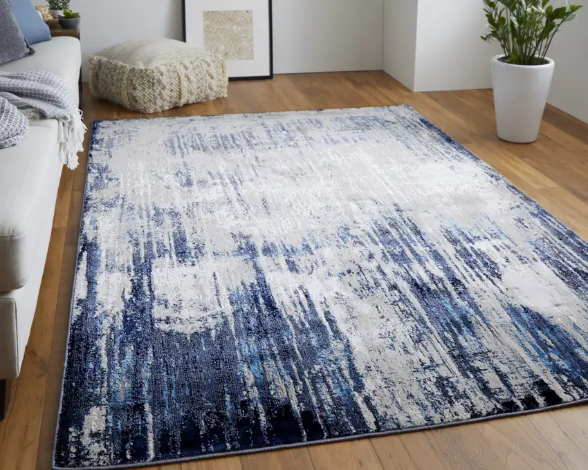 Tan Blue And Ivory Abstract Power Loom Distressed Area Rug Photo 1