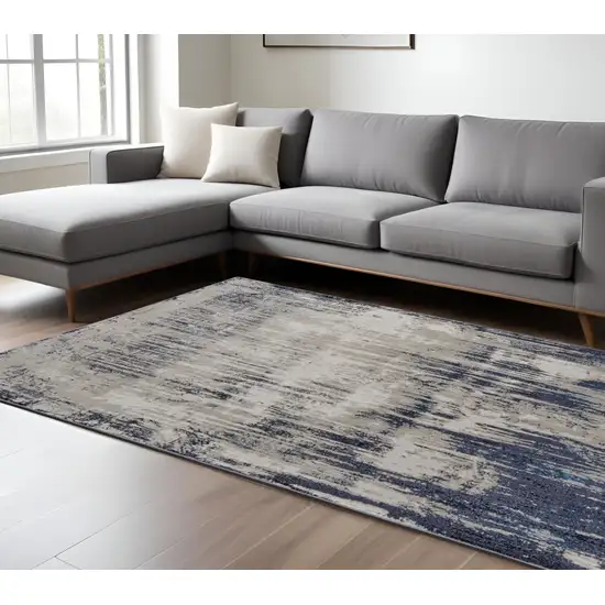 Tan Blue And Ivory Abstract Power Loom Distressed Area Rug Photo 2