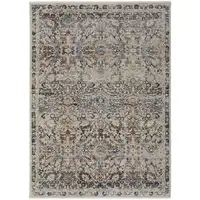 Photo of Tan Blue And Orange Floral Power Loom Distressed Area Rug With Fringe