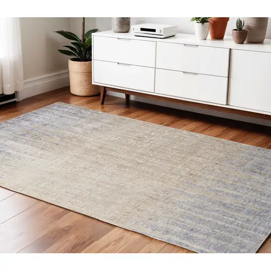 Tan Brown And Blue Abstract Power Loom Distressed Area Rug Photo 1