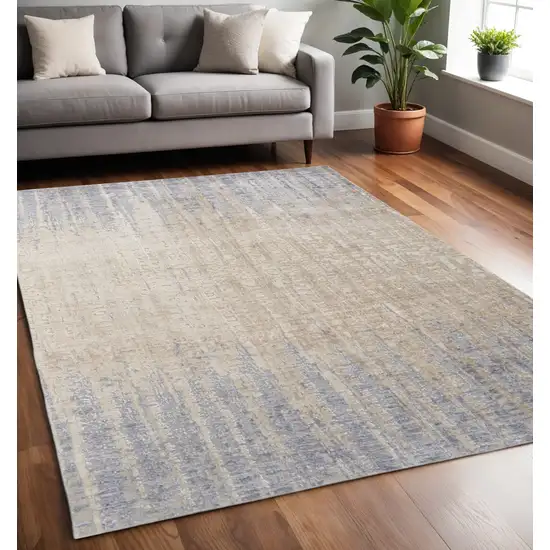 Tan And Blue Abstract Distressed Area Rug Photo 1