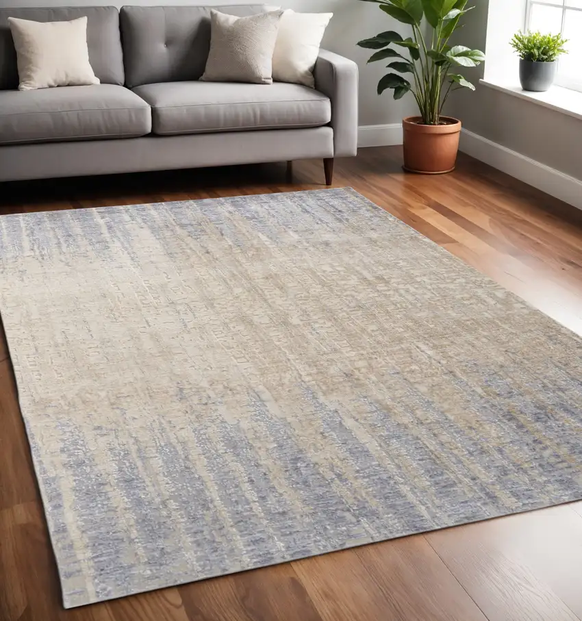 Tan And Blue Abstract Distressed Area Rug Photo 1