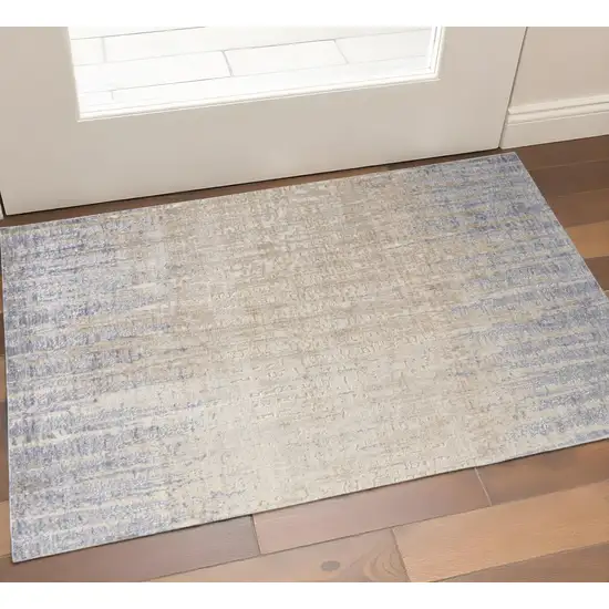 Tan And Blue Abstract Distressed Area Rug Photo 1