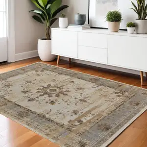 Photo of Tan Brown And Gray Power Loom Distressed Area Rug
