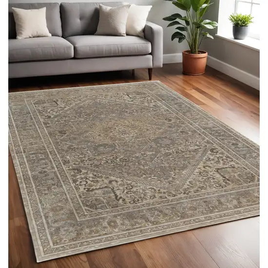 Tan Brown And Ivory Floral Power Loom Distressed Area Rug Photo 1