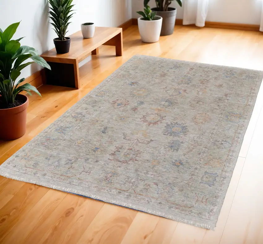 Tan Brown and Blue Floral Hand Woven Distressed Area Rug With Fringe Photo 1