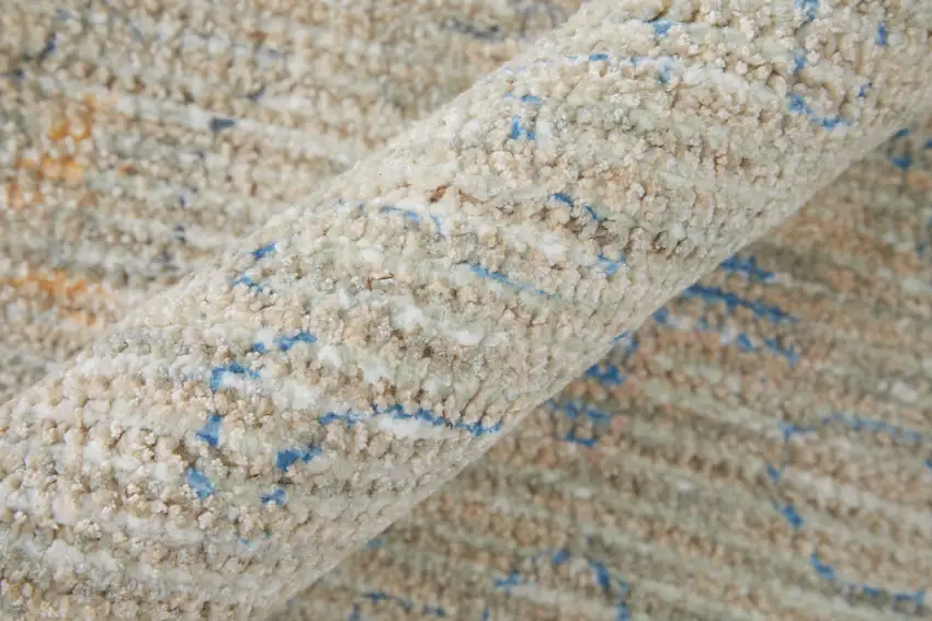 Tan Brown and Blue Floral Hand Woven Distressed Area Rug With Fringe Photo 7