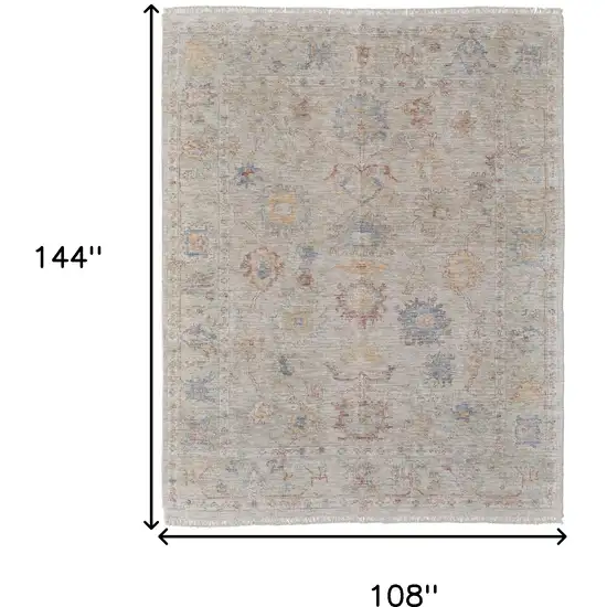 Tan Brown and Blue Floral Hand Woven Distressed Area Rug With Fringe Photo 3