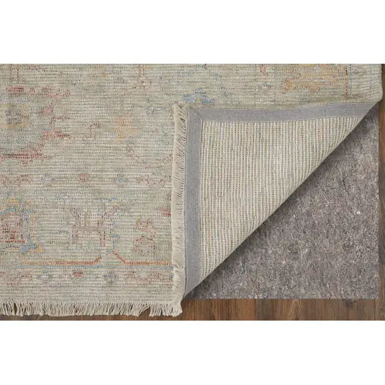 Tan Brown and Blue Floral Hand Woven Distressed Area Rug With Fringe Photo 9